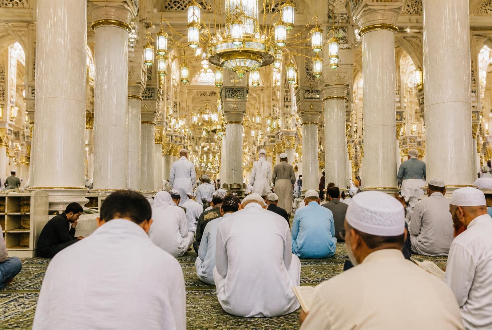 Pilgrims praying inside the marble halls of the Haram